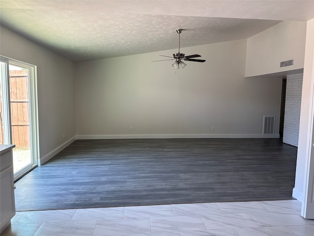 unfurnished room featuring a textured ceiling, high vaulted ceiling, ceiling fan, and light hardwood / wood-style floors