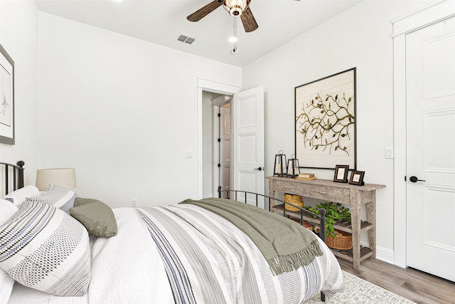 bedroom featuring ceiling fan and light hardwood / wood-style floors