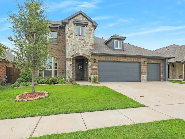 view of front of house with a garage and a front yard