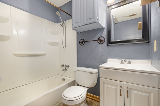 full bathroom with vanity, tub / shower combination, a textured ceiling, and toilet