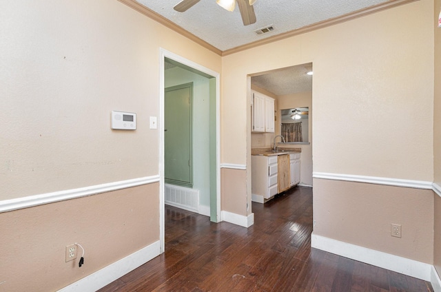 3518 Durango Dr, Dallas, TX 75220 - corridor featuring ornamental molding, sink, a textured ceiling, and dark hardwood / wood-style flooring