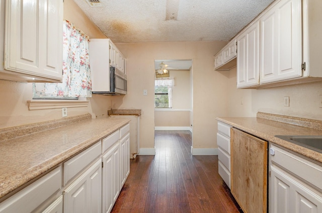 3518 Durango Dr, Dallas, TX 75220 - kitchen featuring white cabinetry, dark wood-type flooring, ceiling fan, and a textured ceiling