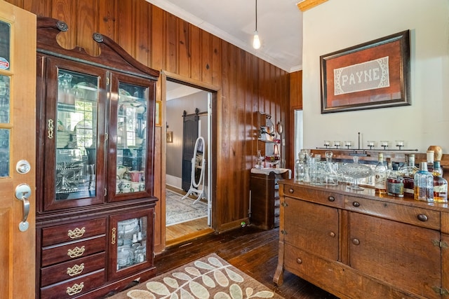 bar with dark hardwood / wood-style flooring, crown molding, and wooden walls