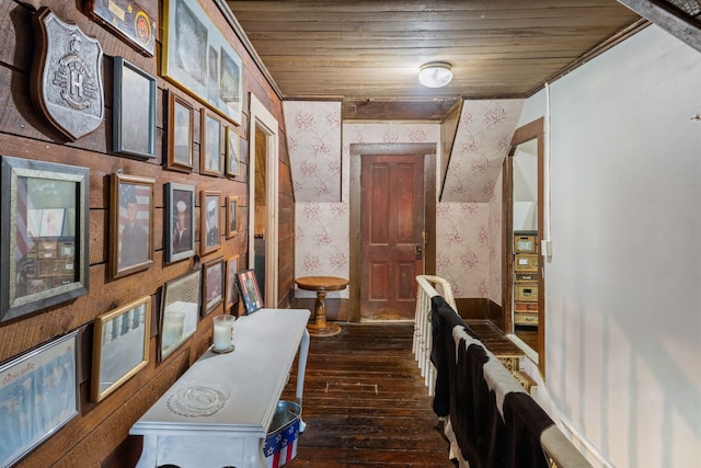 corridor with dark wood-type flooring and wood ceiling