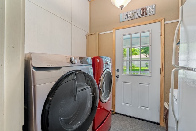 laundry room with washing machine and dryer