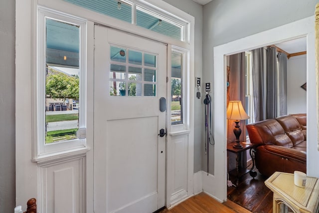 entryway with hardwood / wood-style flooring