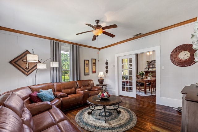 living room featuring dark hardwood / wood-style flooring, ornamental molding, french doors, and ceiling fan