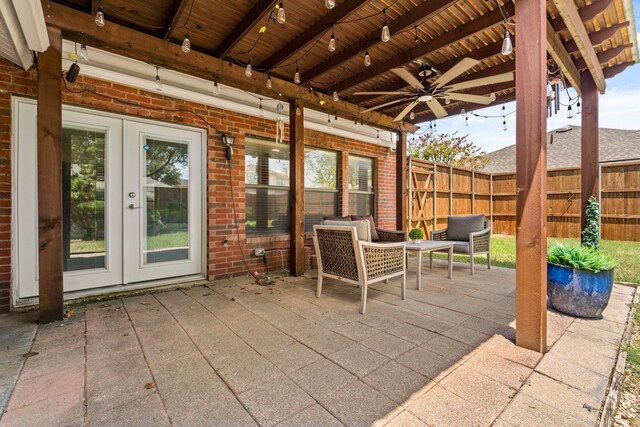 view of patio featuring ceiling fan and french doors