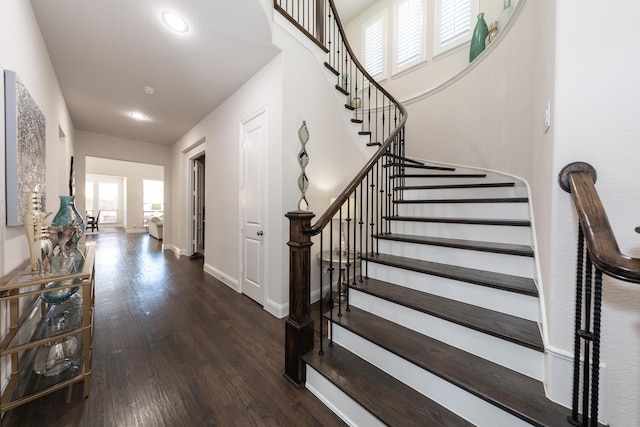 stairs with hardwood / wood-style flooring