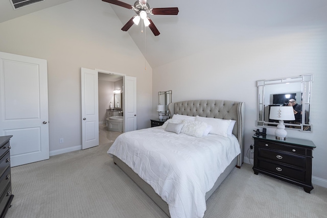 bedroom with ceiling fan, connected bathroom, high vaulted ceiling, and light carpet