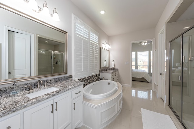 bathroom featuring tile patterned flooring, vanity, shower with separate bathtub, and ceiling fan