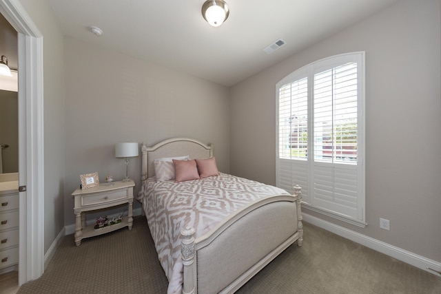 bedroom with light colored carpet