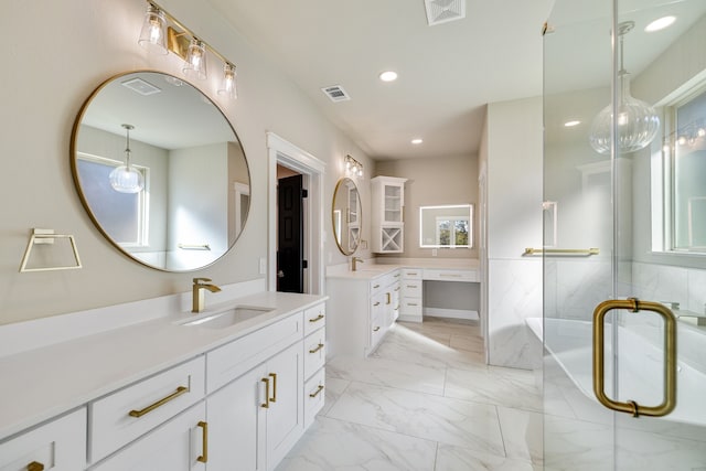 bathroom featuring vanity and an enclosed shower