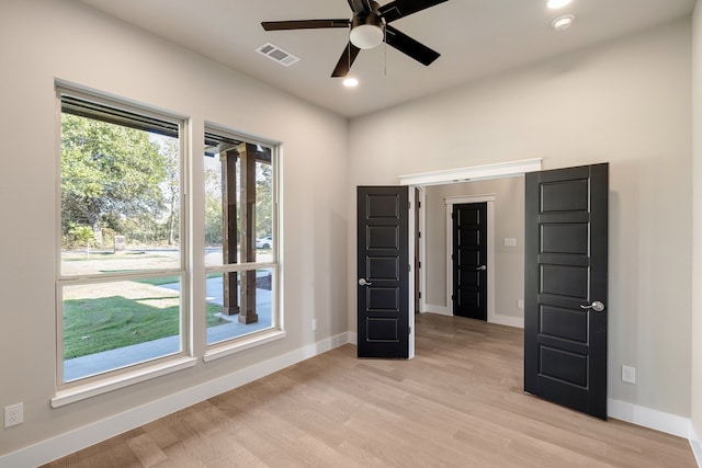 unfurnished bedroom with light hardwood / wood-style floors and ceiling fan