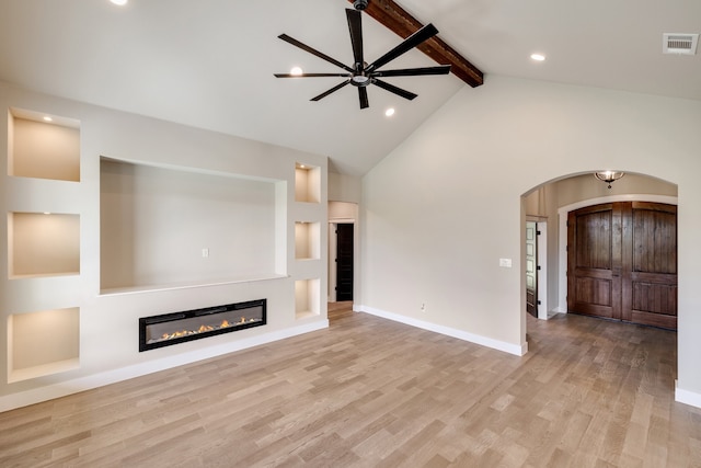 unfurnished living room featuring beamed ceiling, high vaulted ceiling, light hardwood / wood-style floors, and ceiling fan