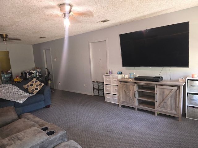 carpeted living room featuring a textured ceiling, a healthy amount of sunlight, and ceiling fan