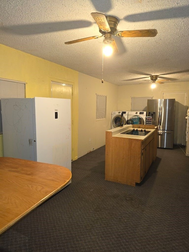 bathroom featuring toilet, a textured ceiling, and vanity