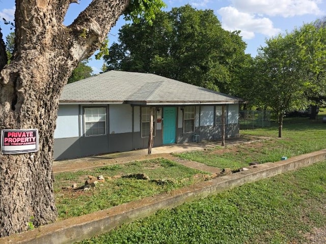 single story home with fence, a front lawn, and stucco siding