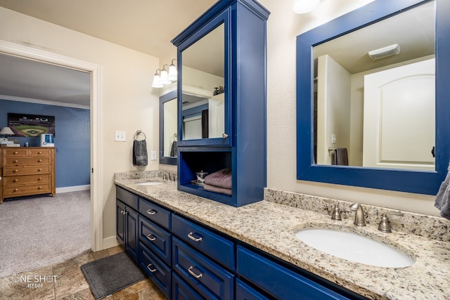 bathroom with double sink vanity and tile patterned flooring