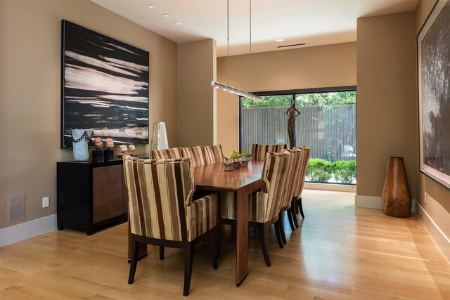 dining room with light hardwood / wood-style floors