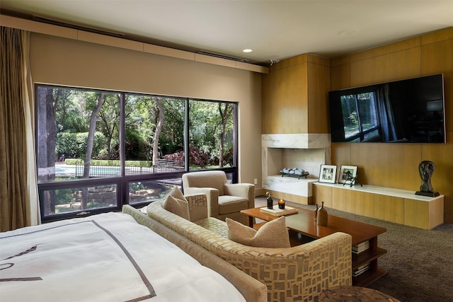 bedroom featuring carpet floors and wood walls