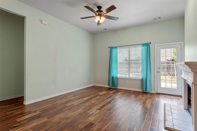 unfurnished living room featuring ceiling fan and wood-type flooring