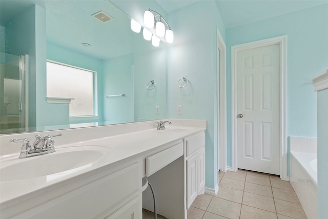 bathroom with double vanity, tile patterned flooring, and independent shower and bath