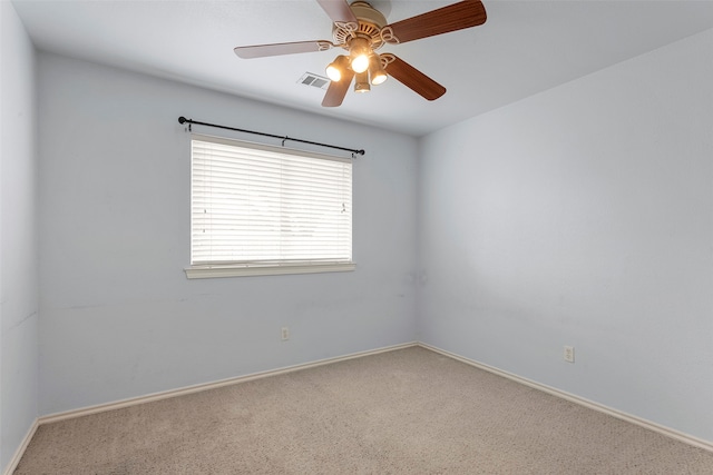 spare room with carpet floors and ceiling fan