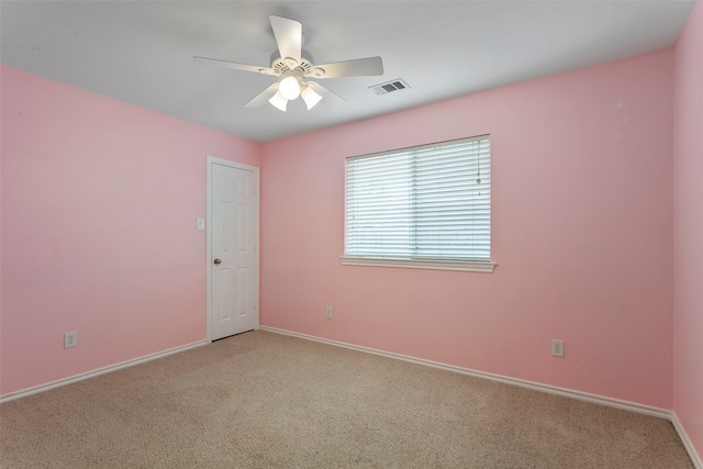 carpeted empty room with ceiling fan