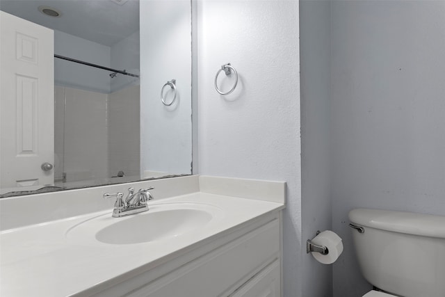 bathroom featuring toilet and vanity