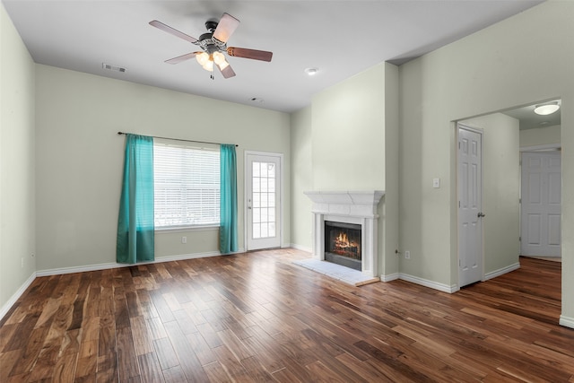 unfurnished living room with hardwood / wood-style flooring and ceiling fan