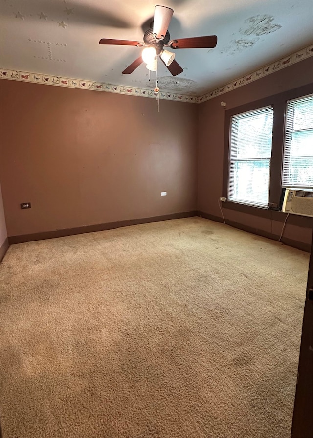 carpeted empty room featuring cooling unit and ceiling fan