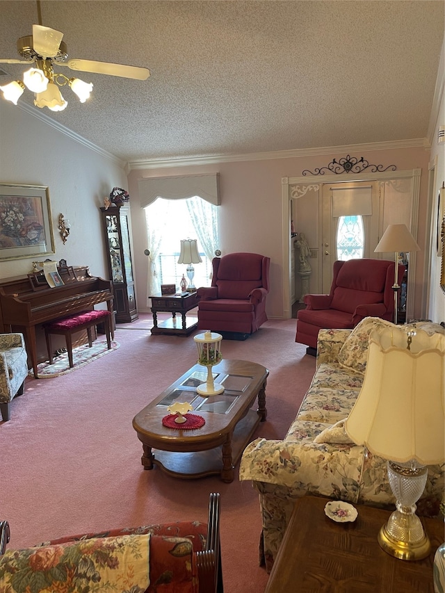 living room with carpet, ceiling fan, ornamental molding, and a textured ceiling