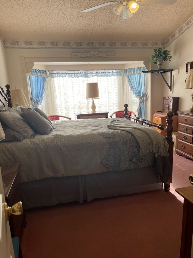 bedroom with carpet, a textured ceiling, and ceiling fan