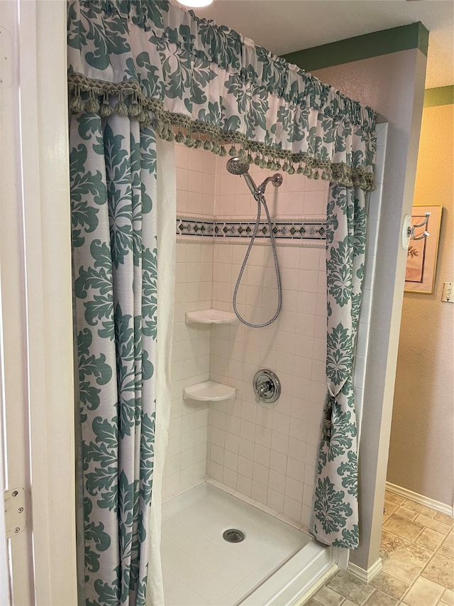 bathroom with tile patterned floors and a shower with curtain