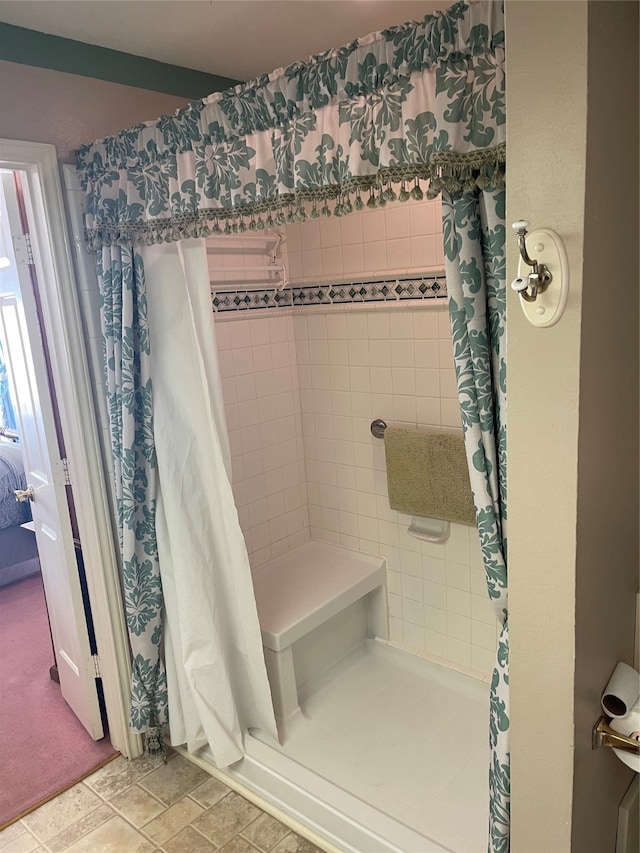 bathroom featuring tile patterned floors and a shower with shower curtain