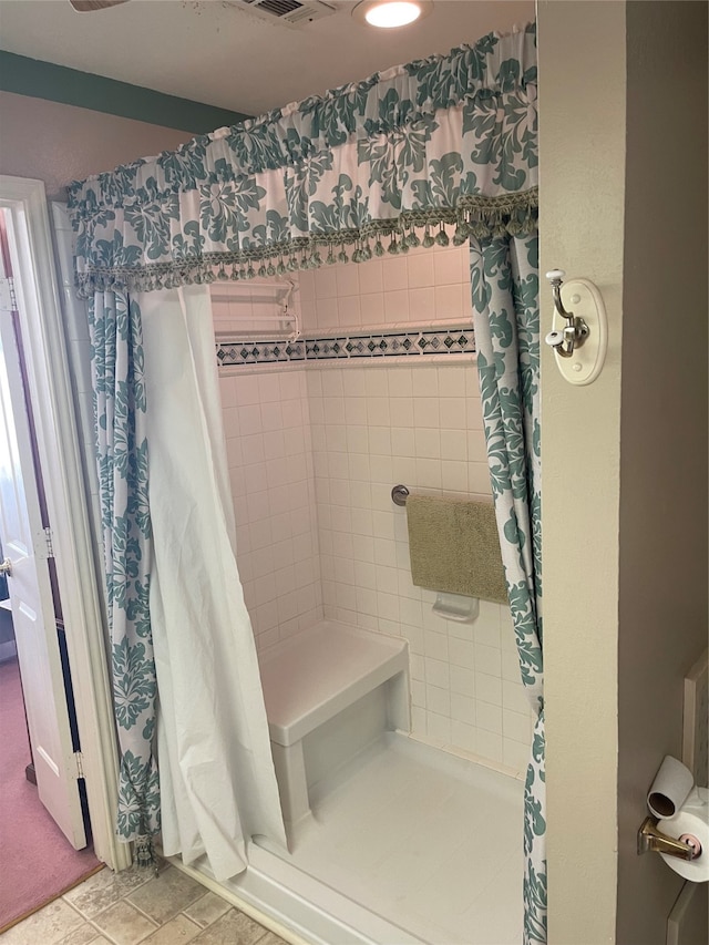 bathroom featuring tile patterned flooring and a shower with curtain