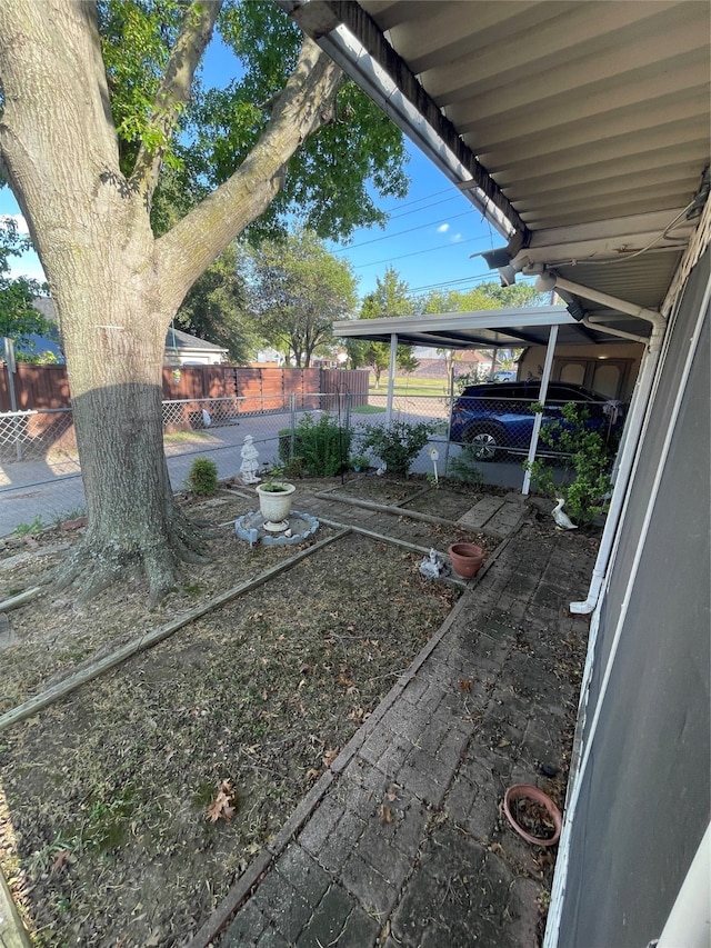 view of yard featuring a carport