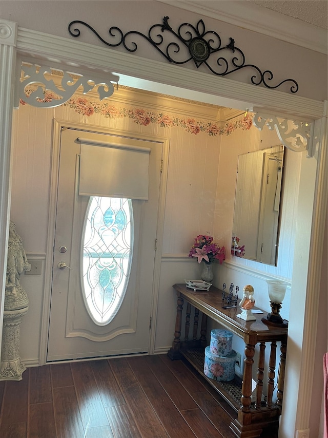 entryway featuring dark hardwood / wood-style floors and ornamental molding