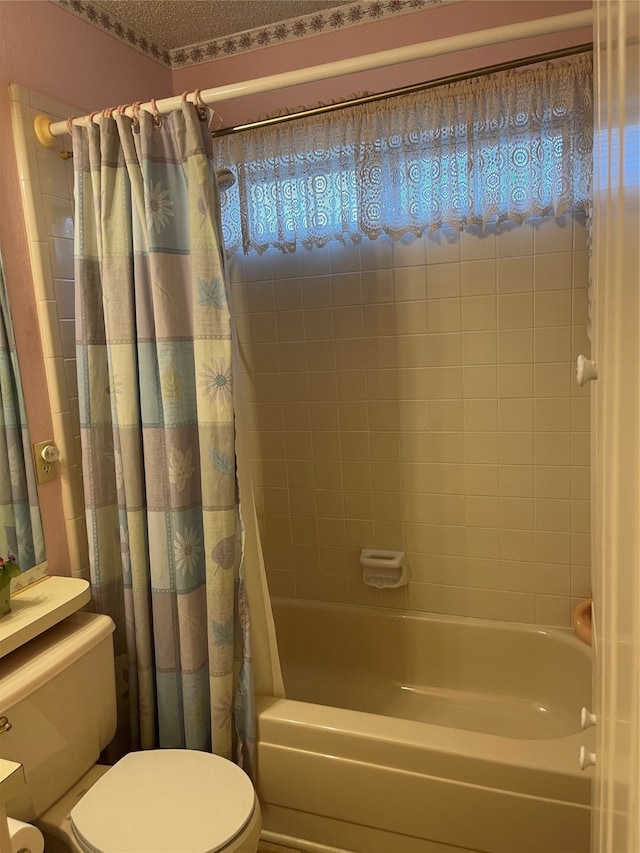 bathroom with shower / bath combo with shower curtain and toilet