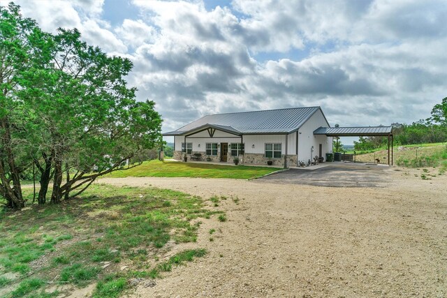 back of property featuring a lawn