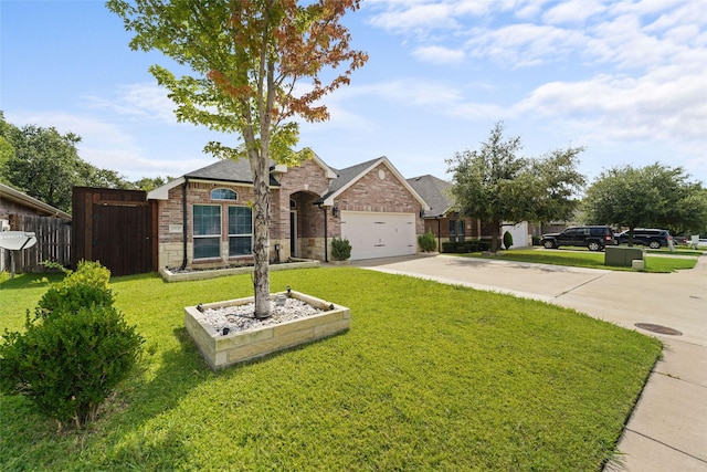 view of front facade featuring a garage and a front yard