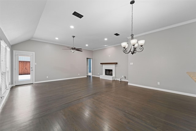 unfurnished living room with dark wood-type flooring, ceiling fan with notable chandelier, vaulted ceiling, and ornamental molding