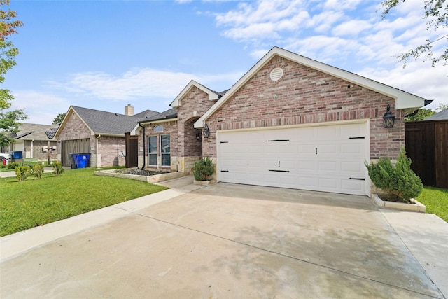 view of front facade featuring a garage and a front lawn