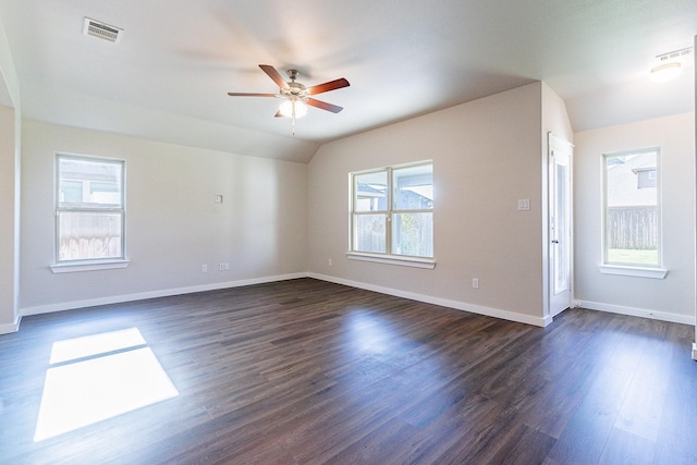 spare room with lofted ceiling, ceiling fan, and dark hardwood / wood-style flooring