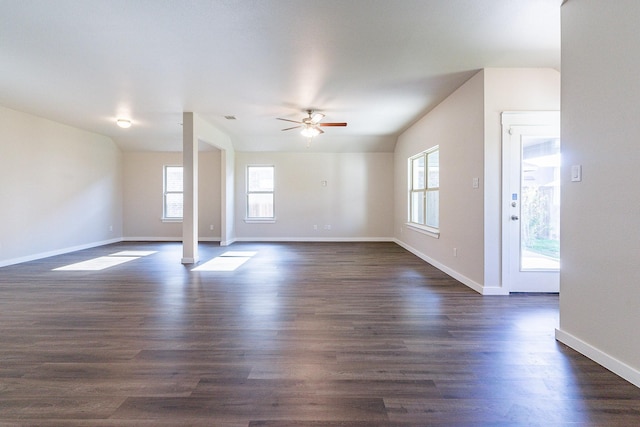 unfurnished living room featuring ceiling fan and dark hardwood / wood-style floors