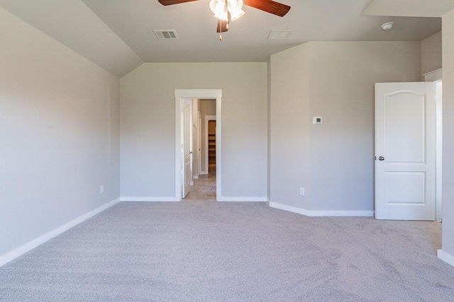 unfurnished bedroom with light carpet, ceiling fan, and lofted ceiling