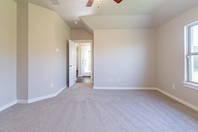 empty room with ceiling fan and light colored carpet