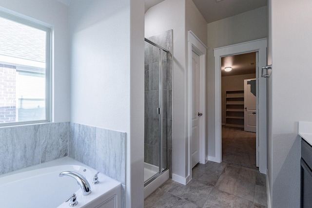 bathroom featuring separate shower and tub and vanity