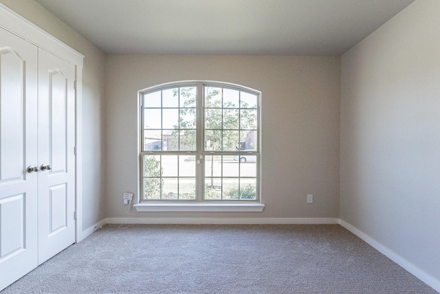 empty room featuring carpet flooring